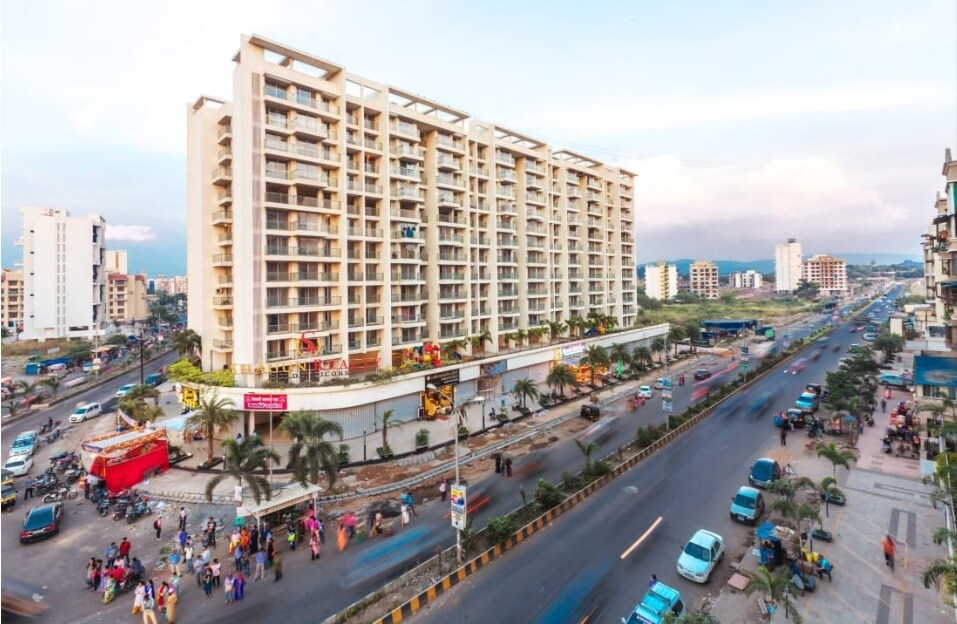 Ulwe Sector 23_a city street filled with lots of tall buildings